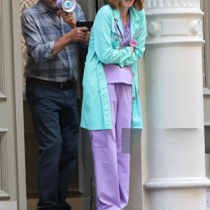 Christina Brucato August 11, 2025 New York City Elsbeth Set Mint Green Medical Lab Coat over Purple Scrubs with Collar, Buttons, and Chest Pocket
