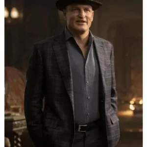 Woody Harrelson wearing a plaid coat in Now You See Me 3; features a bold checkered pattern, tailored fit, and mid-length cut, blending classic menswear style with the character's sharp, illusionist aesthetic.