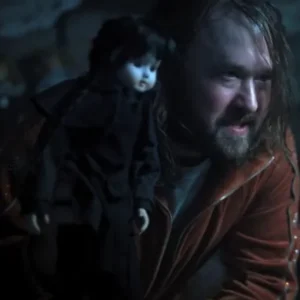 Haley Joel Osment wearing a track jacket in Wednesday Season 2