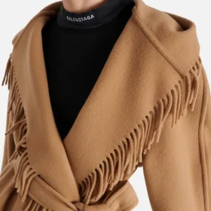 Billie Piper wearing a statement fringe coat in Wednesday S02
